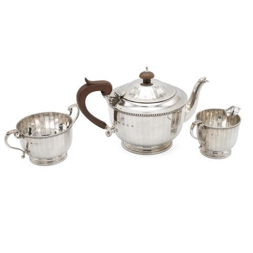 310 - Silver Art Deco three-piece tea service, retailed by Garrard, marked Birmingham 1926, Adie Brothers,... 