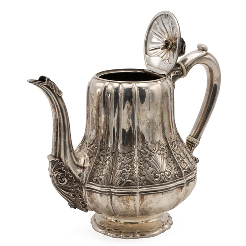 311 - George III,  a silver teapot of boubous outline decorated with shell, leaf and flower border, standi... 