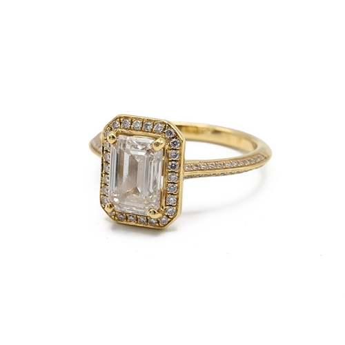 4 - An 18ct yellow gold and diamond ring, set with a mixed step cut diamond, approximately 7.88 x 5.47mm... 