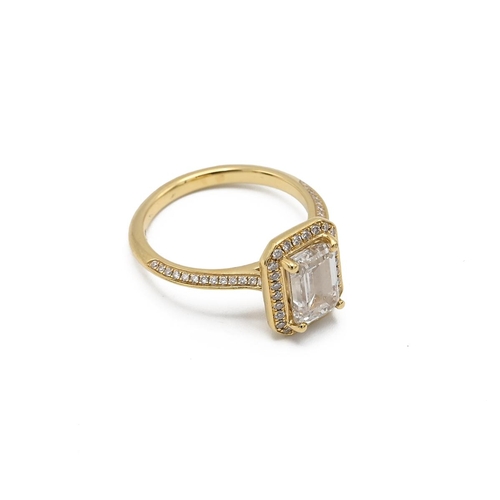 4 - An 18ct yellow gold and diamond ring, set with a mixed step cut diamond, approximately 7.88 x 5.47mm... 