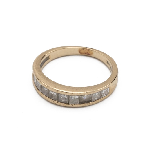 54 - A ten stone diamond half hoop ring, the channel set Princess cuts to a yellow mount stamped ’14K’, f... 