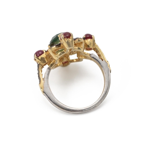 58 - Emerald, ruby and diamond ring. The central emerald enclosed by rose cut diamonds and rubies at the ... 