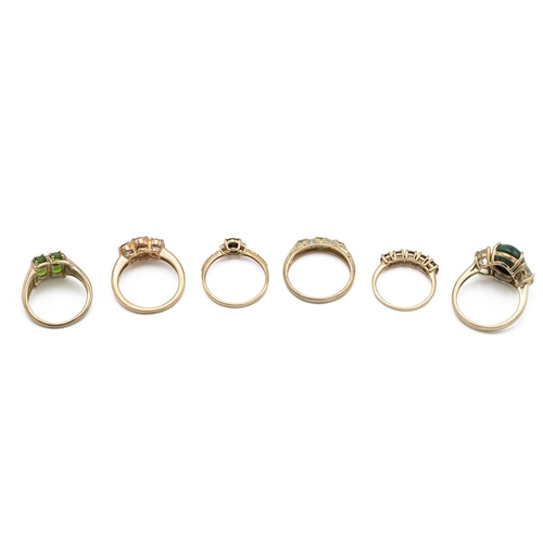 6 - Six modern 9ct gold rings, each set with various gemstones, various sizes and makers, total weight 1... 