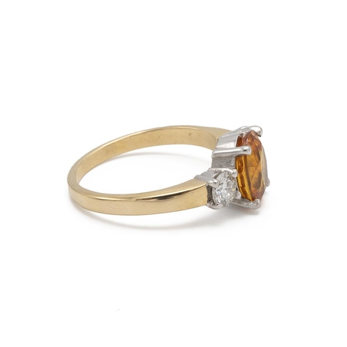 62 - A yellow sapphire and diamond three stone 18ct gold ring, the oval cut sapphire measuring approximat... 