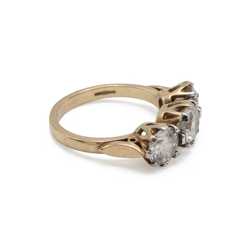 69 - 9ct gold three stone ring, finger size P, 5.4g gross.