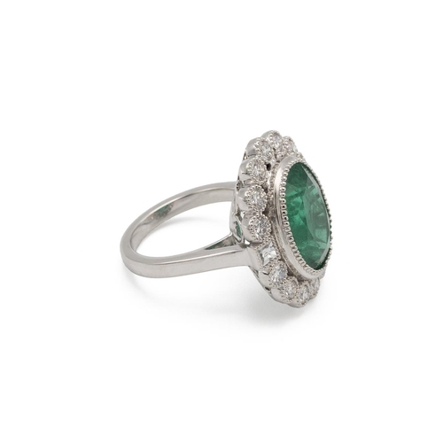 81 - Emerald and diamond cluster ring, the oval cut stone estimated as weighing approximately 7.5ct, encl... 