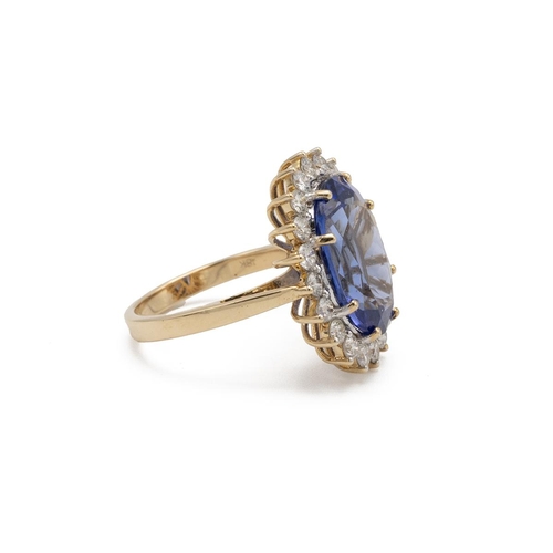 84 - Tanzanite and diamond cluster ring, the oval cut tanzanite estimated as weighing approximately 8ct, ... 