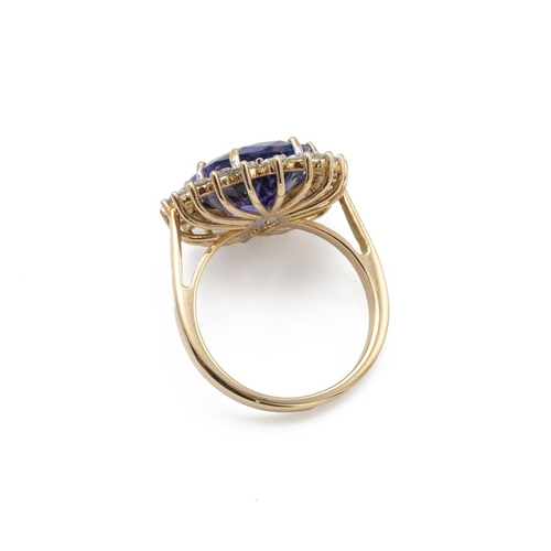 84 - Tanzanite and diamond cluster ring, the oval cut tanzanite estimated as weighing approximately 8ct, ... 