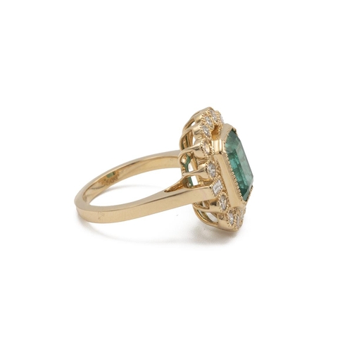 85 - An emerald and diamond cluster ring, the step cut stone estimated as weighing approximately 4.6ct, e... 