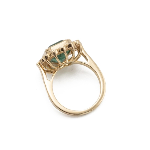 85 - An emerald and diamond cluster ring, the step cut stone estimated as weighing approximately 4.6ct, e... 