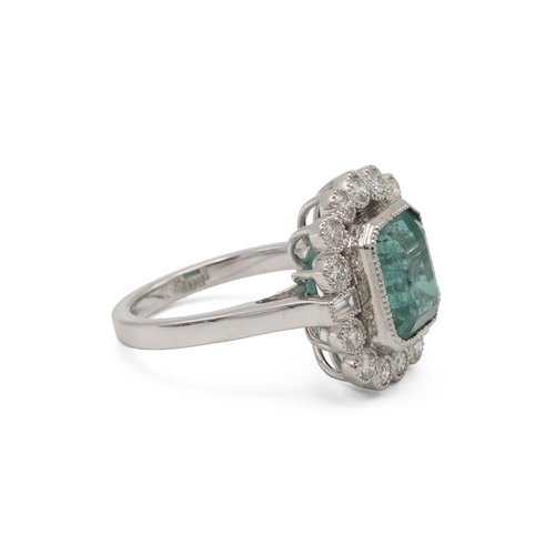 87 - Emerald and diamond cluster ring, the step cut stone estimated as weighing approximately 4.8ct, encl... 