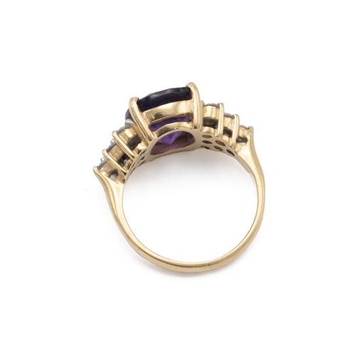 92 - An amethyst and diamond cluster ring, the cushion-shaped fancy cut flanked to either side by six bri... 