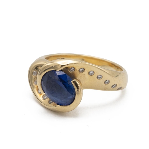 94 - Liz Tyler, a sapphire and diamond 18ct gold ‘Corona’ dress ring, the oval cut stone to a heavy cross... 