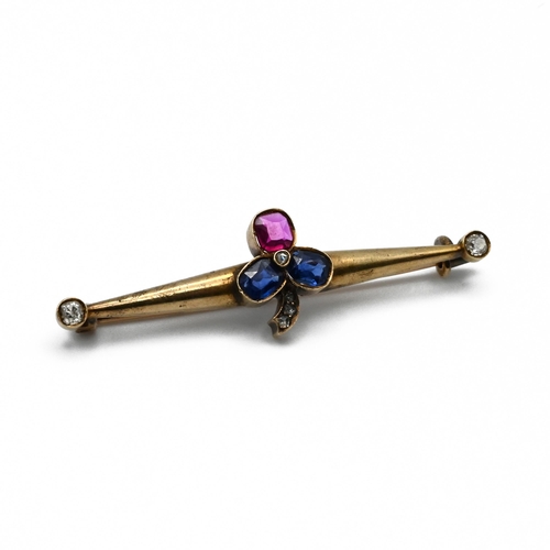 96 - A Russian sapphire, ruby, and diamond bar brooch, the stone set clover motif with old cut diamond te... 