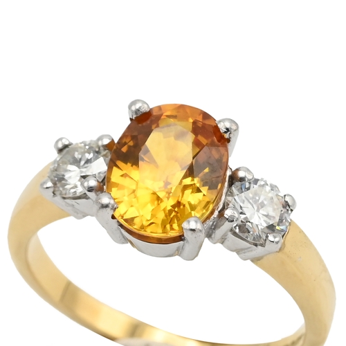 62 - A yellow sapphire and diamond three stone 18ct gold ring, the oval cut sapphire measuring approximat... 