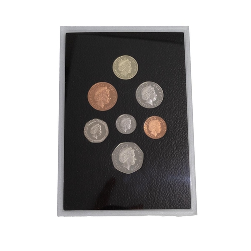 108 - Two (2) Royal Mint base metal commemorative coin sets. Includes 2008 Royal Shield of Arms seven-coin... 