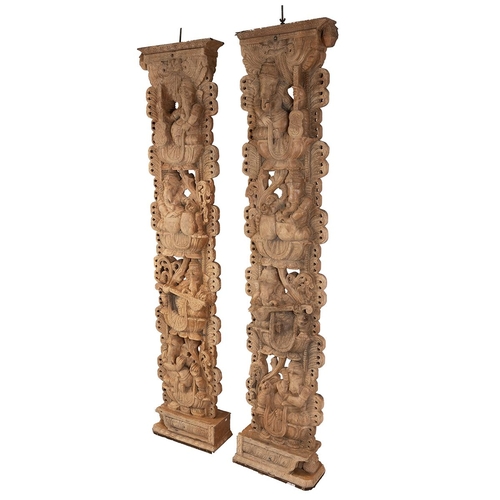 142 - Pair tall vintage Indian carved hardwood wooden pillars with Ganesh iconography. Profusely carved to... 