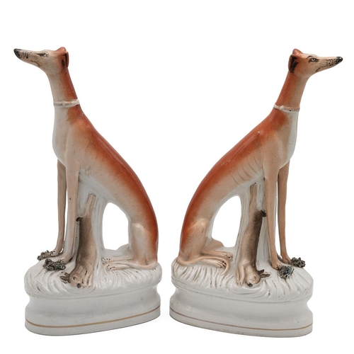 160 - 'High and Mighty' - pair of 19th Century Staffordshire flatbacks of hunting dogs with hares. H 32cm.