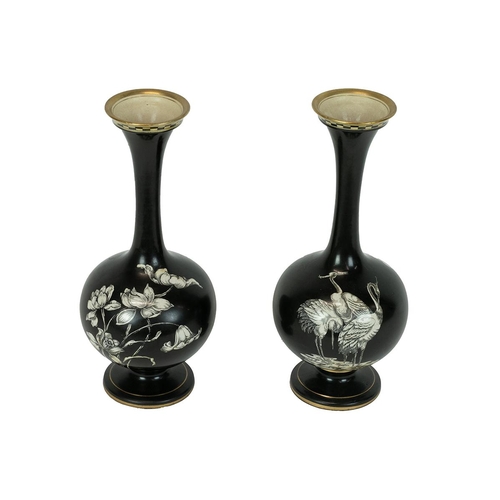 179 - T Forester Ltd Phoenix Ware - a pair of Cairo pattern bottle form vases in black with white pattern ... 