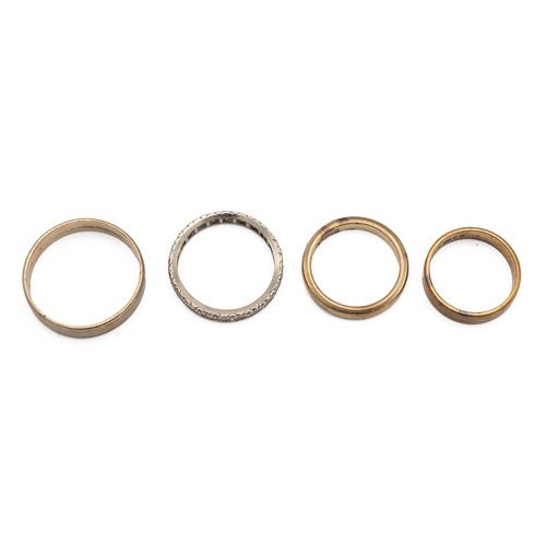 19 - Four 9ct Gold rings to include  a wedding band size K, another size J1/2, a third size T and a white... 