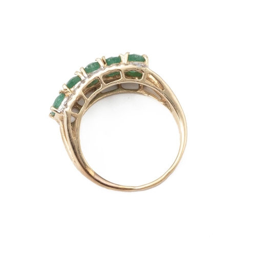 2 - 14ct gold, emerald and white stone cluster ring, the curved setting set with five emeralds surround ... 