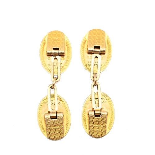 21 - Pair 9ct gold cufflinks, engine-turned decoration to front. (5.5g)