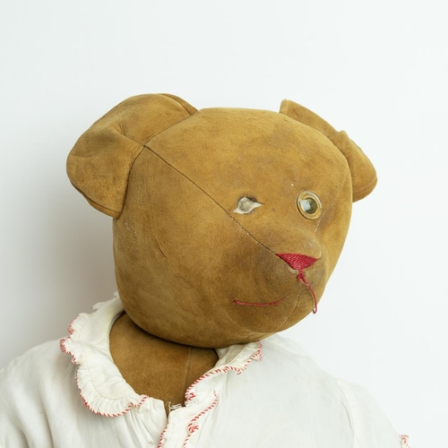 238 - Early 20th Century Teddy Bear, suede covered with one glass eye, humped back, well stuffed, dressed ... 