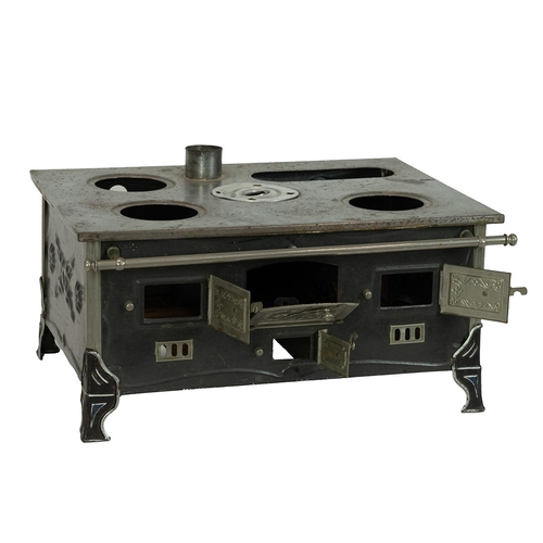 243 - Antique Marklin tinplate stove and pots, early 20th Century. H 20cm, W 37cm, D 29cm.