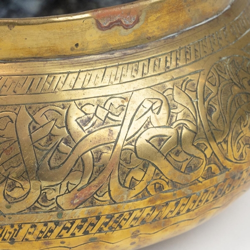 303 - Middle East brass items to include two large embossed water ewers (H 27cm) and two brass bowls (D 19... 