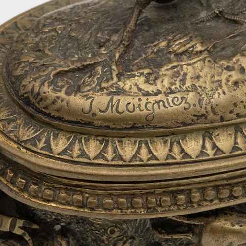 306 - After Jules Moigniez, a gilt brass velvet lined jewellery box, oval form, decorated in relief with a... 