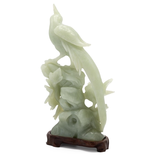 313 - Vintage Chinese carved jade depicting two birds on a flower, on a wooden stand. Overall height 24.5c... 