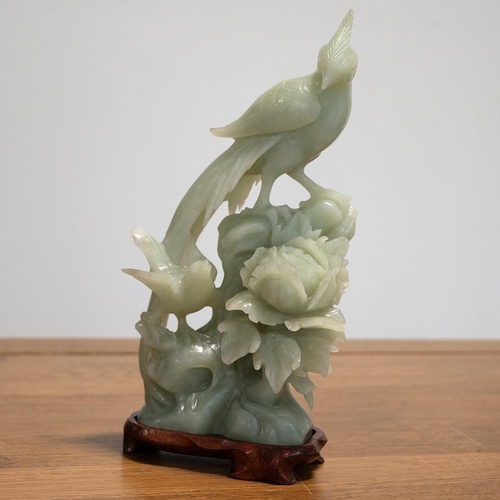 313 - Vintage Chinese carved jade depicting two birds on a flower, on a wooden stand. Overall height 24.5c... 