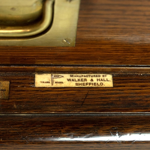 316 - Mid 20th Century oak cased canteen of cutlery. Small cabinet with lockable hinged doors (key present... 