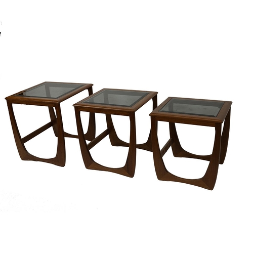 340 - Mid century nest of teak tables, bevelled smoked glass tops, c1960s. Largest: H 52cm, W 48cm, D 48cm... 