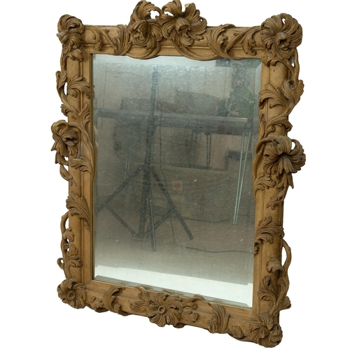 371 - Vintage Continental carved wood mirror, foliate carved detail, bevel edged plate. H 94cm, W 80cm. 