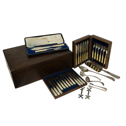 53 - Various silver-plated cutlery, along with an associated oak case.