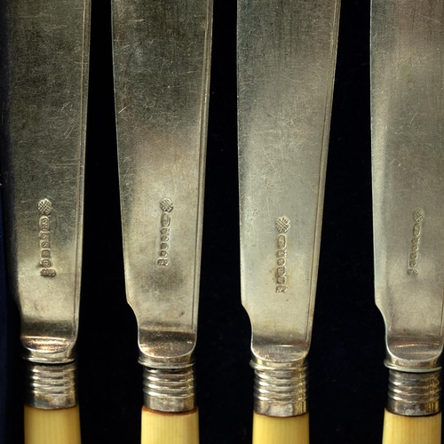 53 - Various silver-plated cutlery, along with an associated oak case.