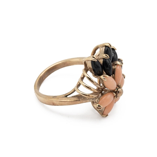 8 - A coral and black stone set flower ring, marked 14kt GB, 4.17 grams,  finger size M. Testing with an... 