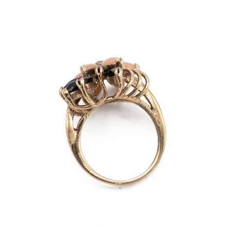 8 - A coral and black stone set flower ring, marked 14kt GB, 4.17 grams,  finger size M. Testing with an... 