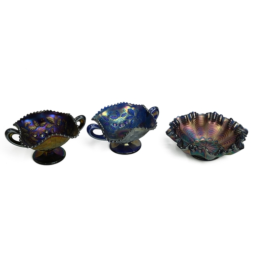 195 - Carnival Glass - mostly amethyst colour - to include Fenton Peacock bowl, Indiana goblet, 2 x Northw... 