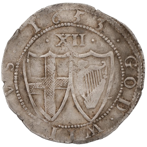 104 - 1653 Commonwealth silver Shilling, sun mintmark (S 3217, North 2724). Obverse: English shield within... 