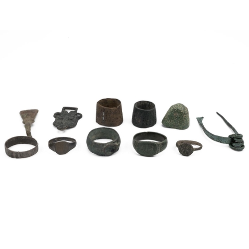 485 - Eleven (11) metal detecting finds, including Roman and medieval rings, beehive thimbles, a brooch an... 