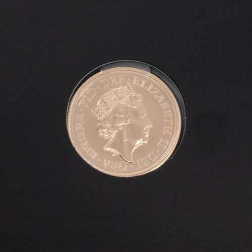 95 - 2019 Elizabeth II gold Sovereign in card sleeve.