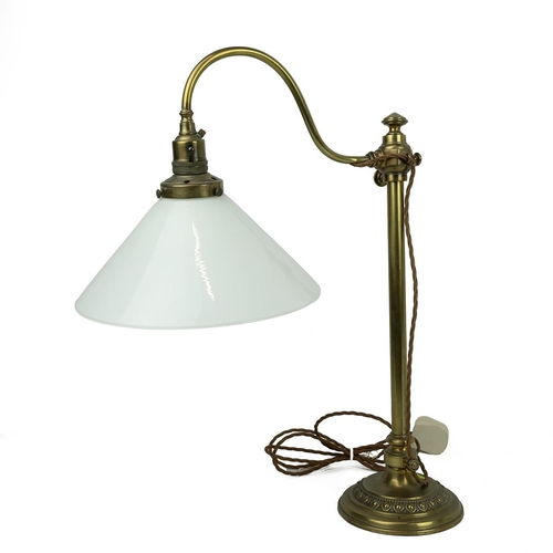 151 - A brass Victorian style table lamp with over hanging glass shade, H51cm. and a green glass table lam... 