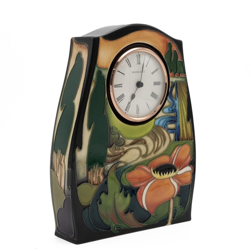 163 - A Moorcroft pottery clock in the Ryden Fields pattern designed by Emma Bossons, printed mark verso a... 