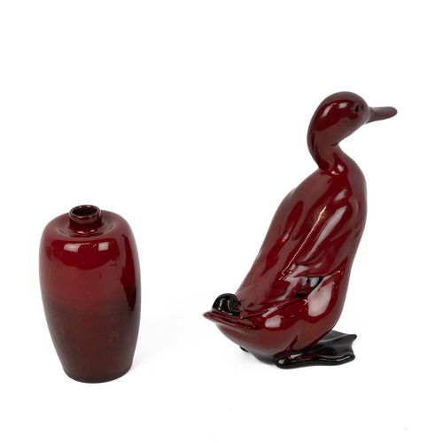 166 - Royal Doulton Flambe ware: A duck (H 16cm) with printed mark to base; and a Woodcote pattern high ne... 