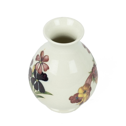 182 - Walter Moorcroft baluster form vase, circa 1960’s, cream ground tube lined decoration of spring flow... 