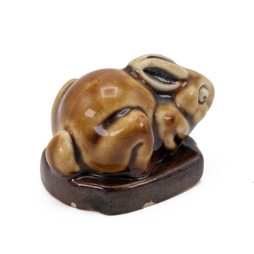 190 - Royal Doulton - crouching rabbit figurine modelled by Mark V Marshall circa 1902 in honey coloured g... 