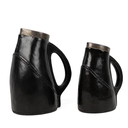 196 - Royal Doulton Lambeth 'Black Jack' jugs with silver collars hallmarked for London 1928 and 1929, mak... 