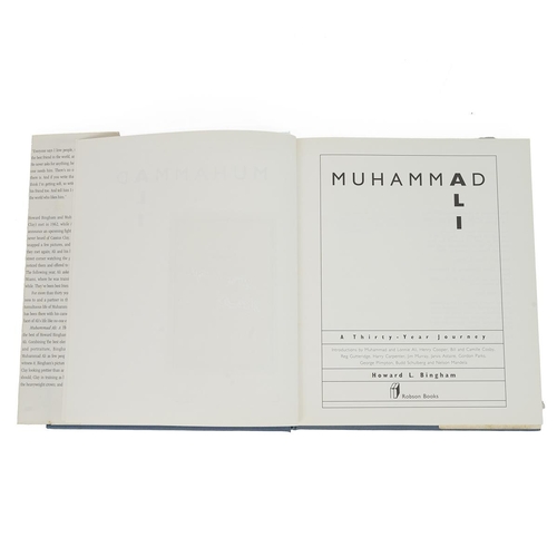 295 - Muhammad Ali signed book titled 'A THIRTY YEAR JOURNEY' by Howard L.Bingham to include a signed phot... 